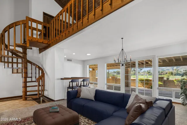 a kitchen with a sink a counter top space and a large window