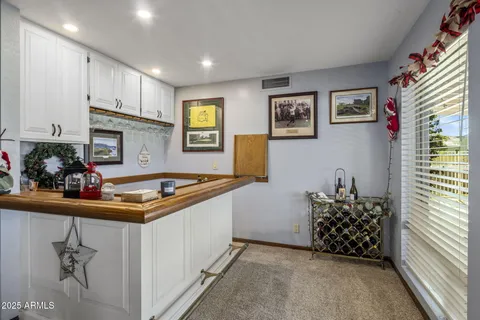 a room with furniture a dining table and chairs