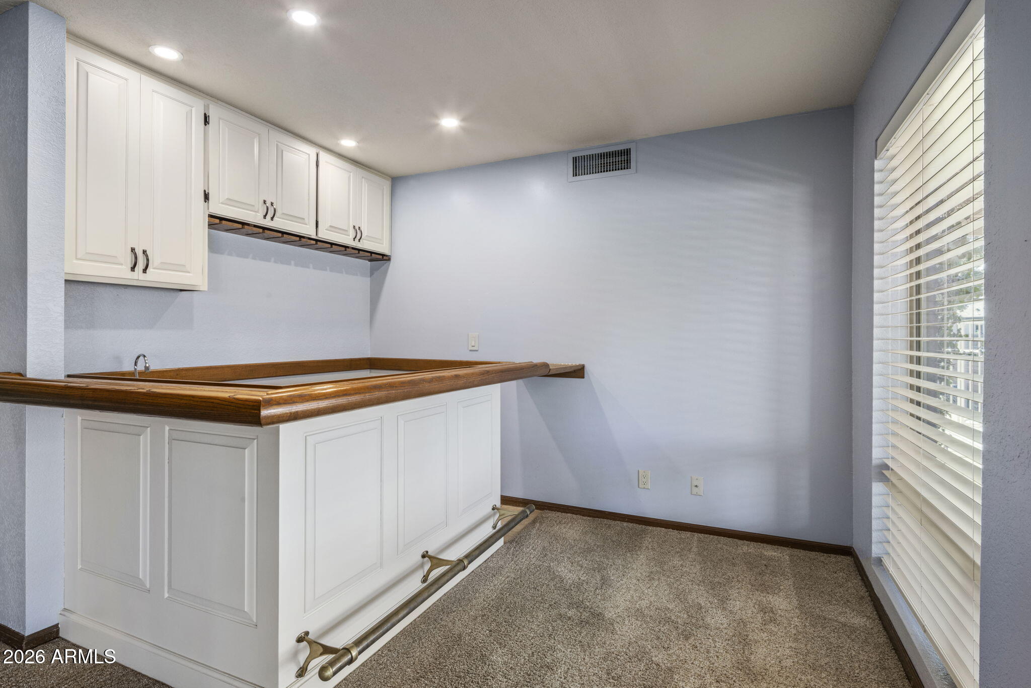 5555 East Turquoise Avenue Paradise Valley, AZ 85253 - Photo 19 of 47 a kitchen with a sink and cabinets
