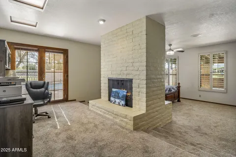 a bedroom with a bed and a fireplace