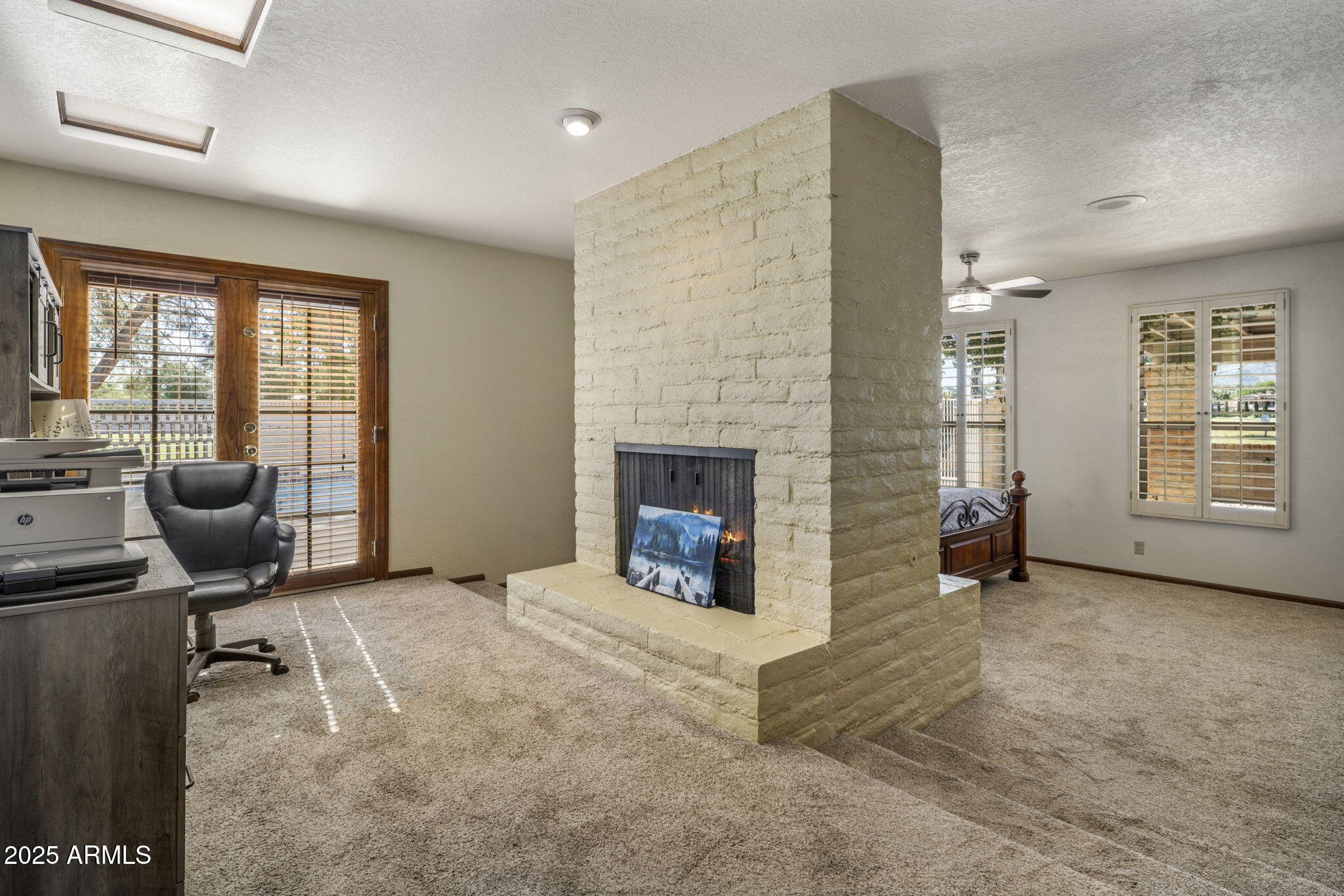 5555 East Turquoise Avenue Paradise Valley, AZ 85253 - Photo 19 of 36 a room with furniture and a fireplace