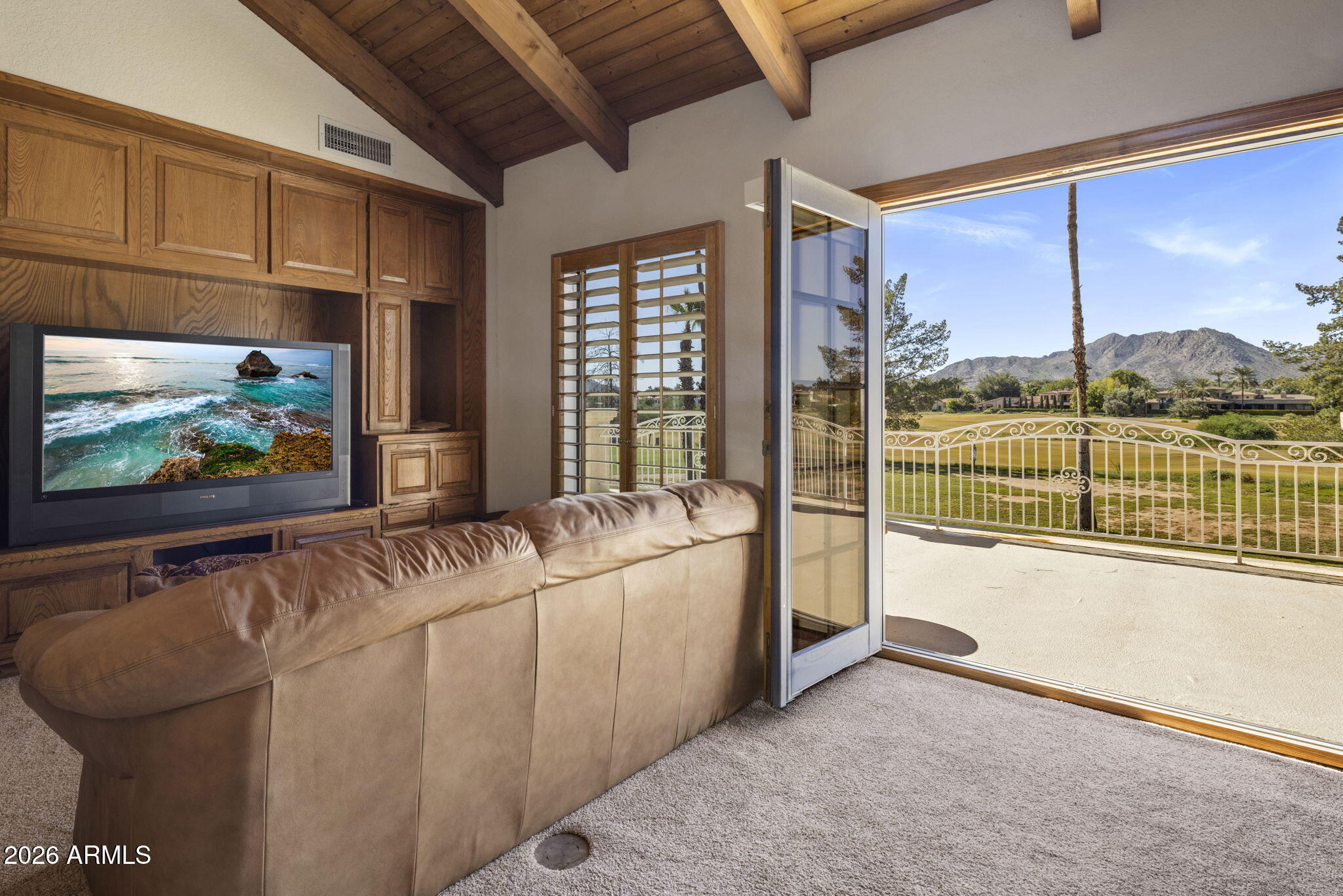 5555 East Turquoise Avenue Paradise Valley, AZ 85253 - Photo 21 of 47 a living room with furniture and a flat screen tv