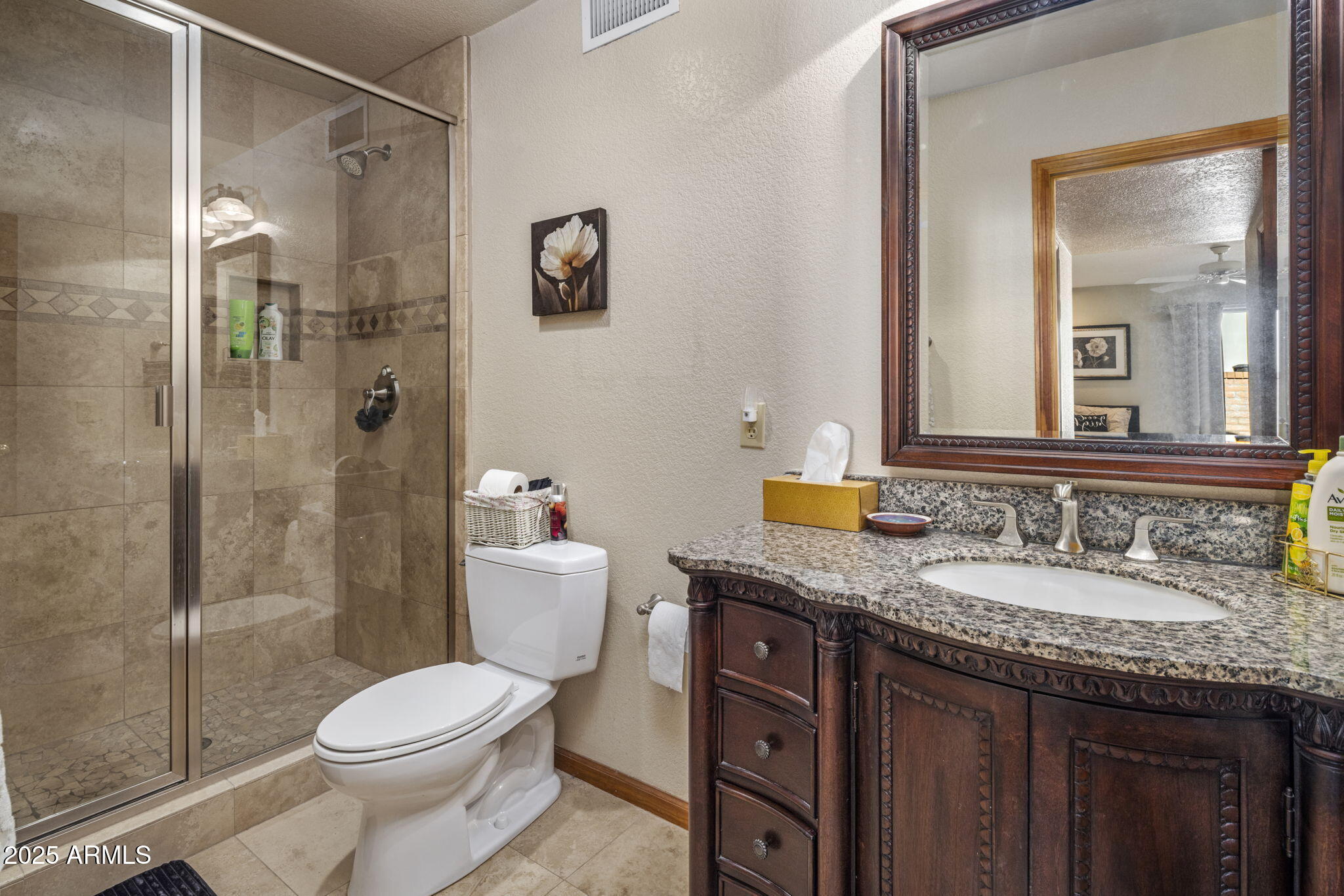 5555 East Turquoise Avenue Paradise Valley, AZ 85253 - Photo 23 of 36 a bathroom with a granite countertop sink toilet and shower
