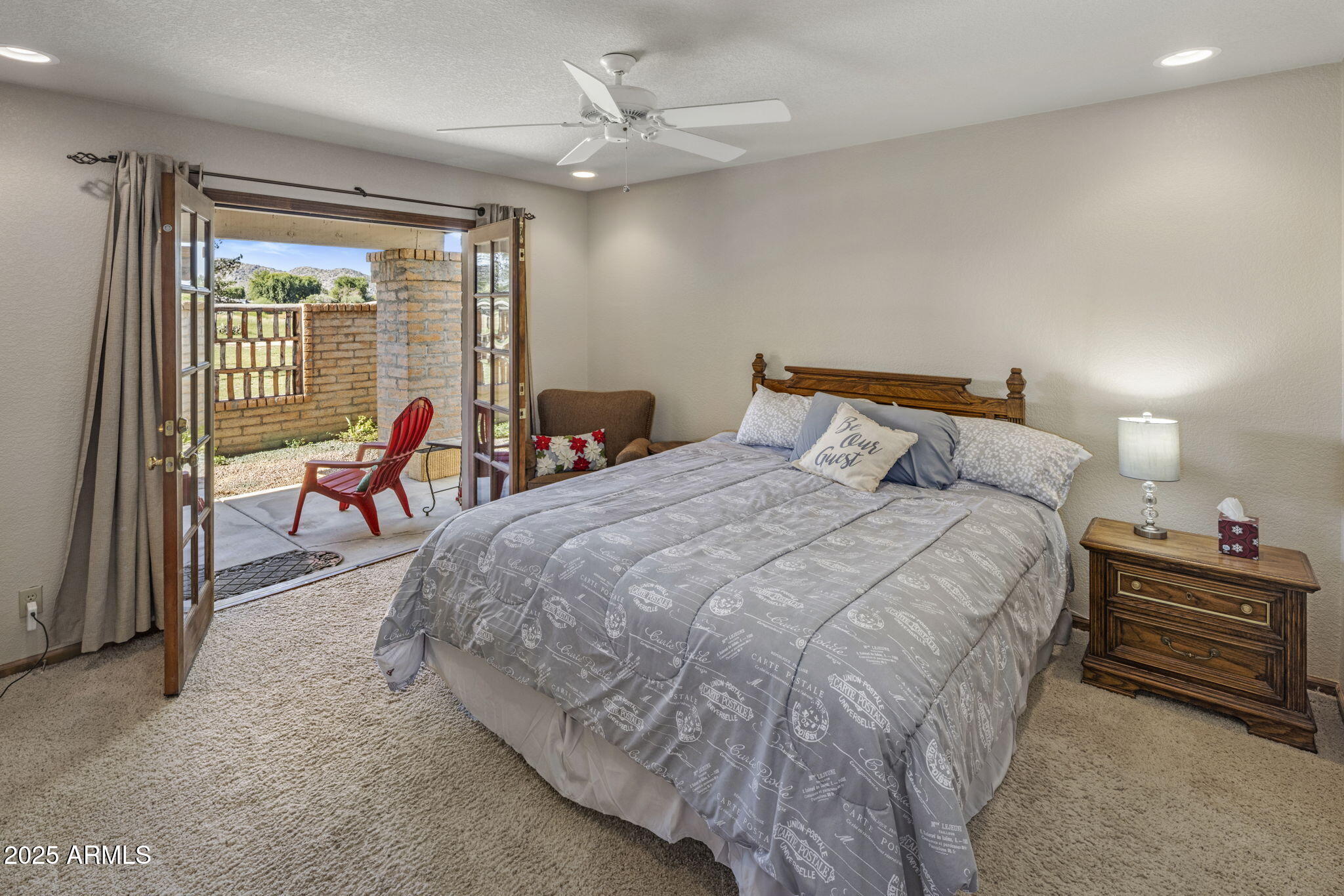 5555 East Turquoise Avenue Paradise Valley, AZ 85253 - Photo 24 of 36 a bed room with a bed and a large window