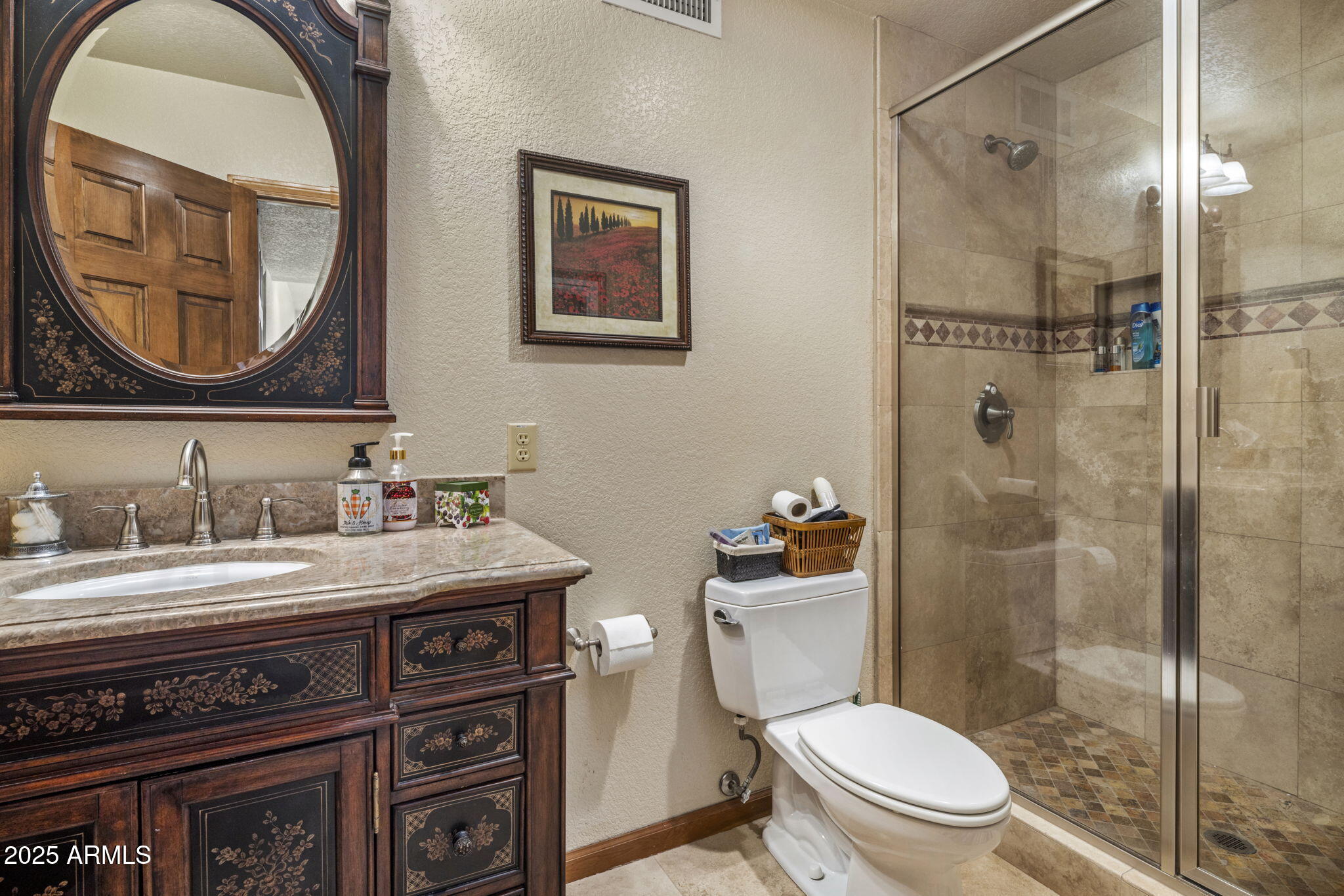 5555 East Turquoise Avenue Paradise Valley, AZ 85253 - Photo 25 of 36 a bathroom with a granite countertop toilet a sink and a mirror