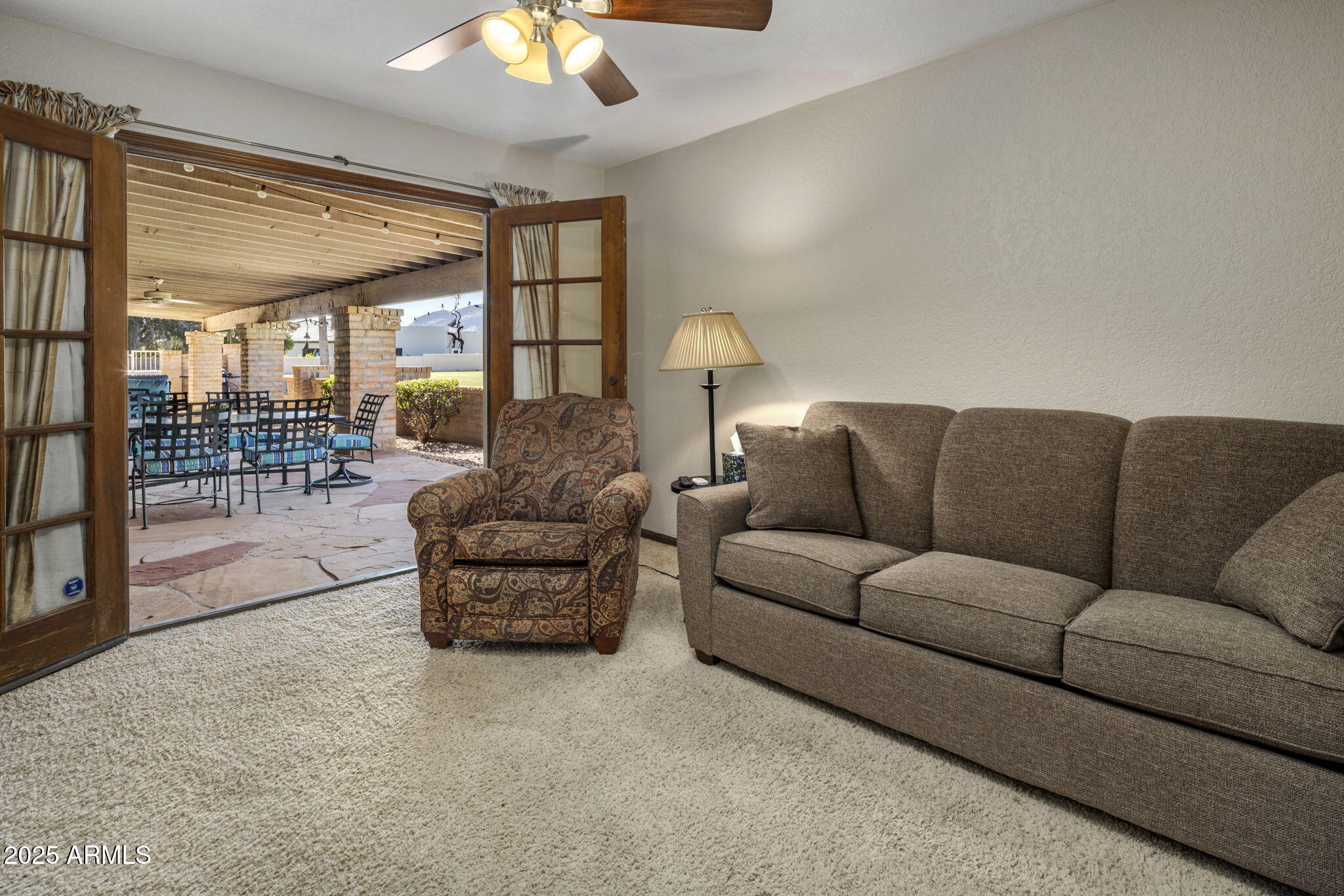 5555 East Turquoise Avenue Paradise Valley, AZ 85253 - Photo 26 of 36 a living room with furniture and a large window