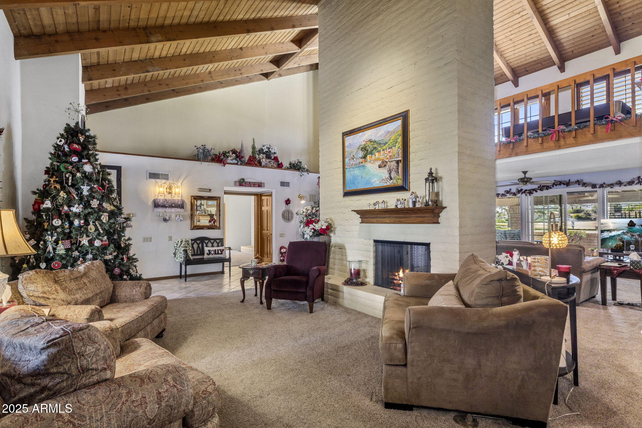 5555 East Turquoise Avenue Paradise Valley, AZ 85253 - Photo 3 of 36 a living room with furniture large window and fireplace