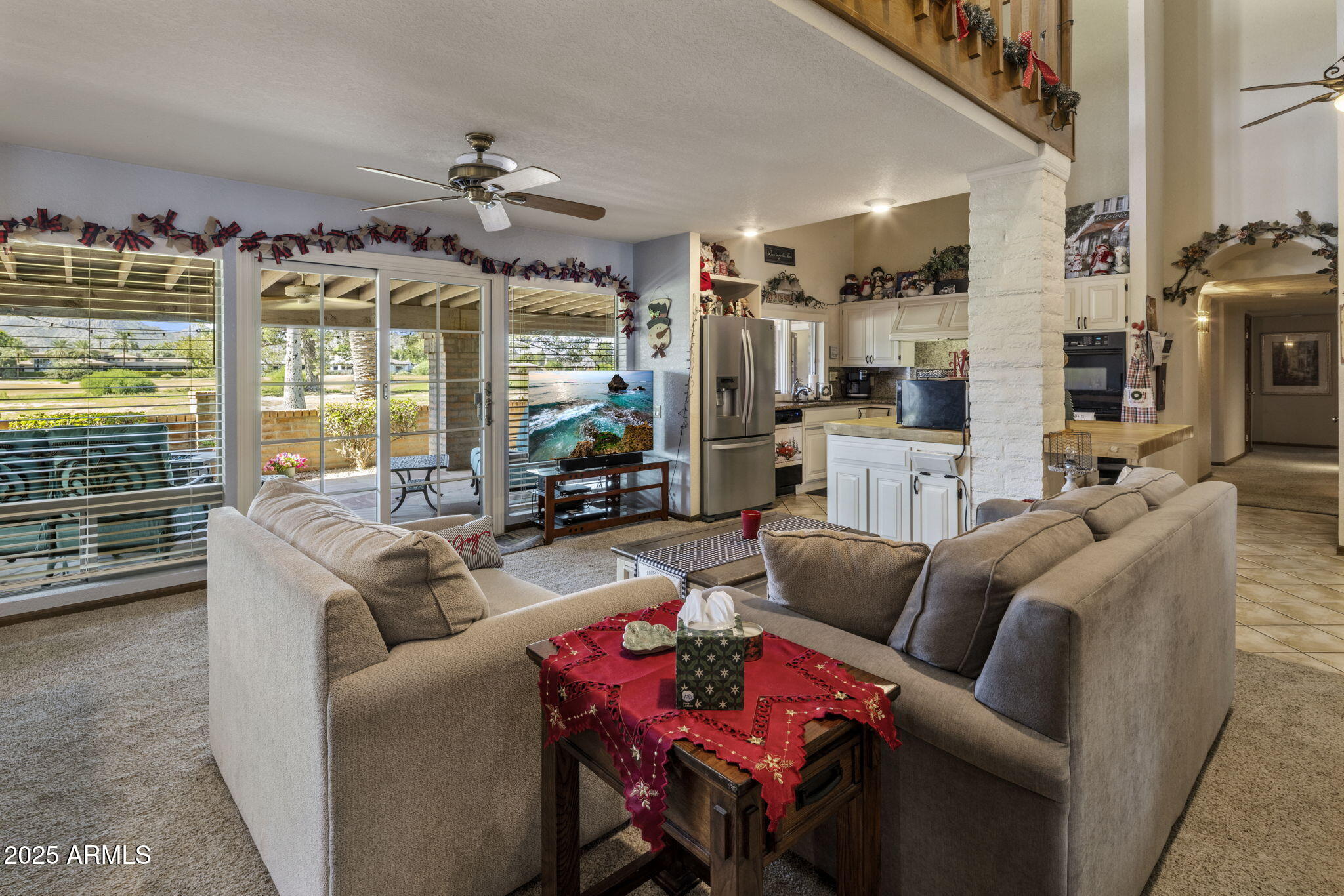 5555 East Turquoise Avenue Paradise Valley, AZ 85253 - Photo 7 of 36 a living room with furniture fireplace and a large window