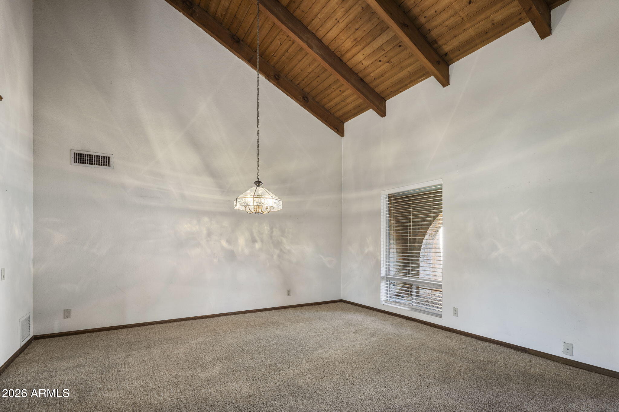 5555 East Turquoise Avenue Paradise Valley, AZ 85253 - Photo 8 of 47 an empty room with windows