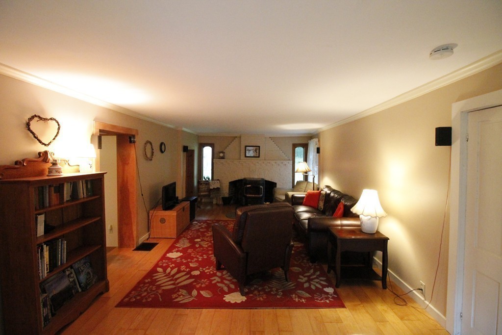 10 Judd Road Heath, MA 01339 - Photo 13 of 26 a living room with furniture a flat screen tv and a fireplace