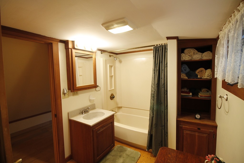 10 Judd Road Heath, MA 01339 - Photo 25 of 26 a bathroom with a shower sink and mirror