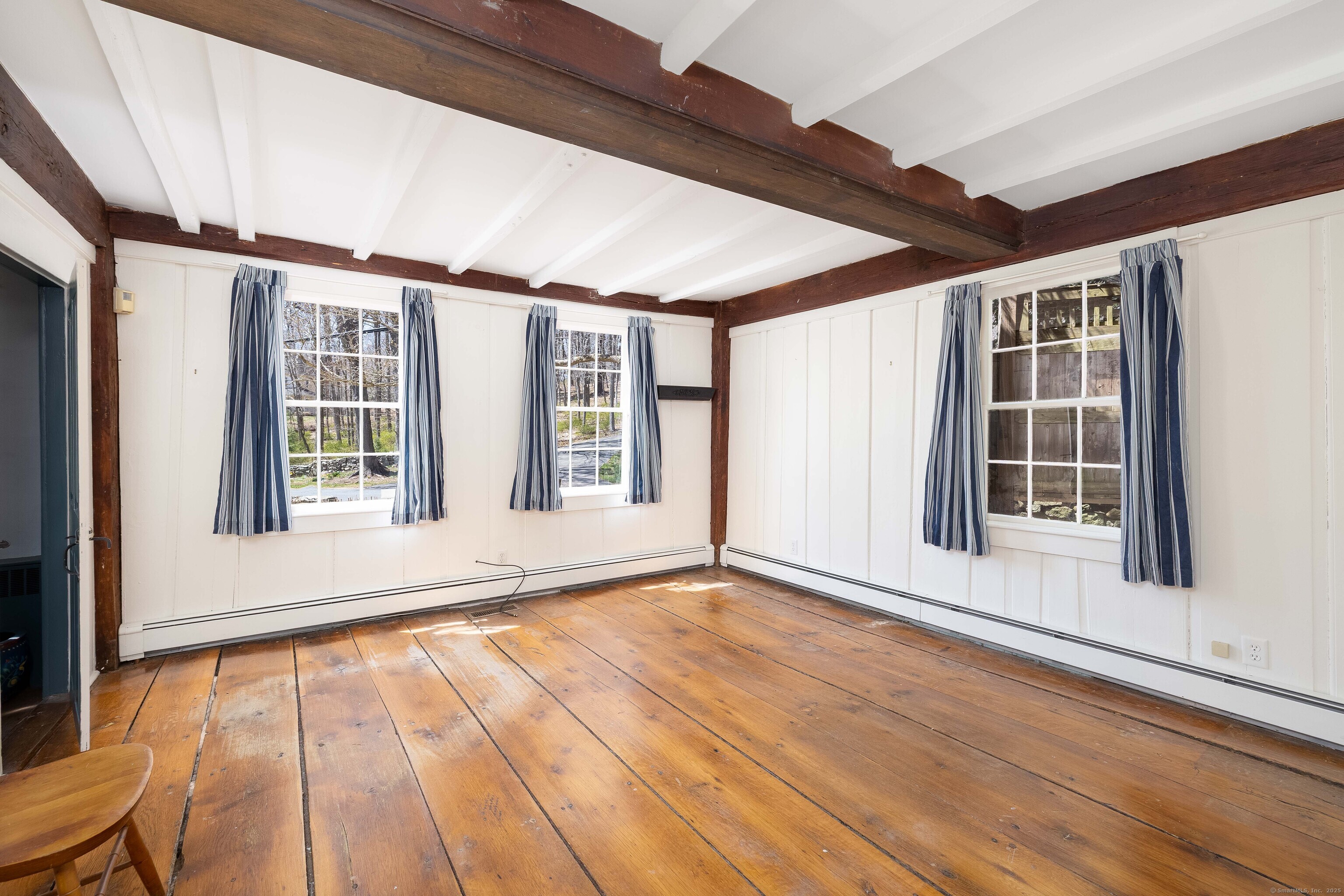 180 Green Hill Road Killingworth, CT 06419 - Photo 18 of 39 a view of an empty room with a window and wooden floor