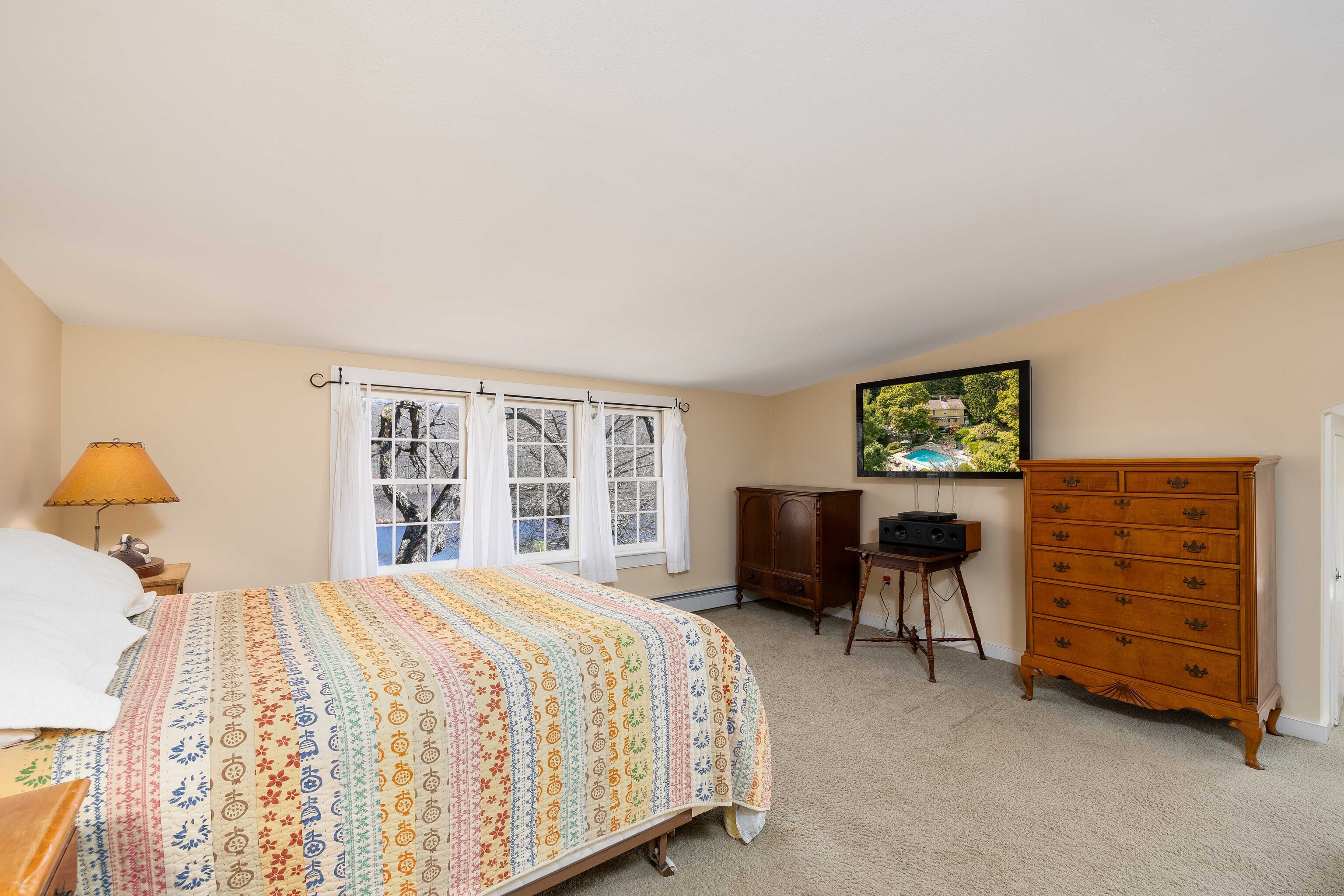180 Green Hill Road Killingworth, CT 06419 - Photo 27 of 39 a bedroom with a bed and a table in it