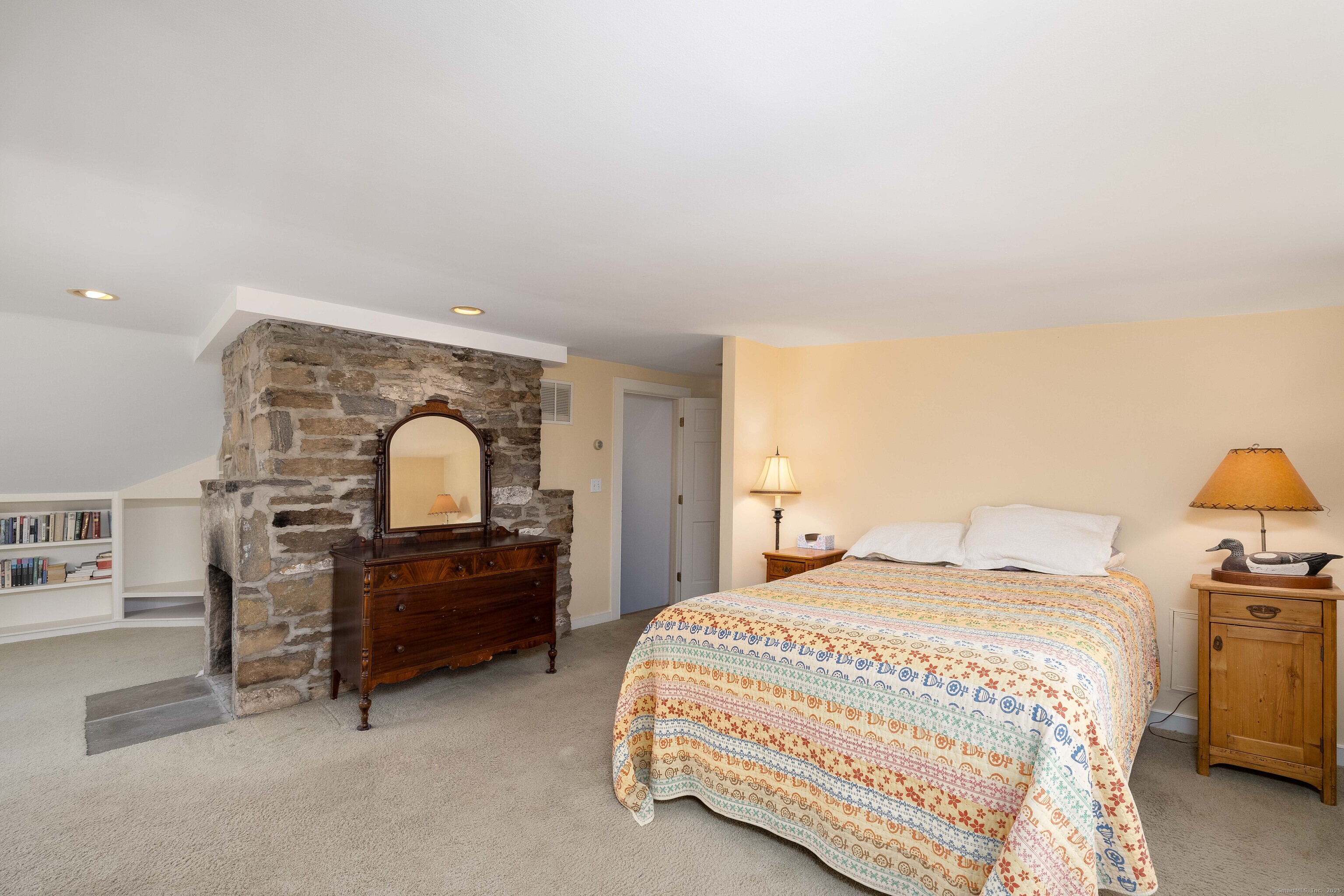 180 Green Hill Road Killingworth, CT 06419 - Photo 28 of 39 a bedroom with a bed and a lamp on table