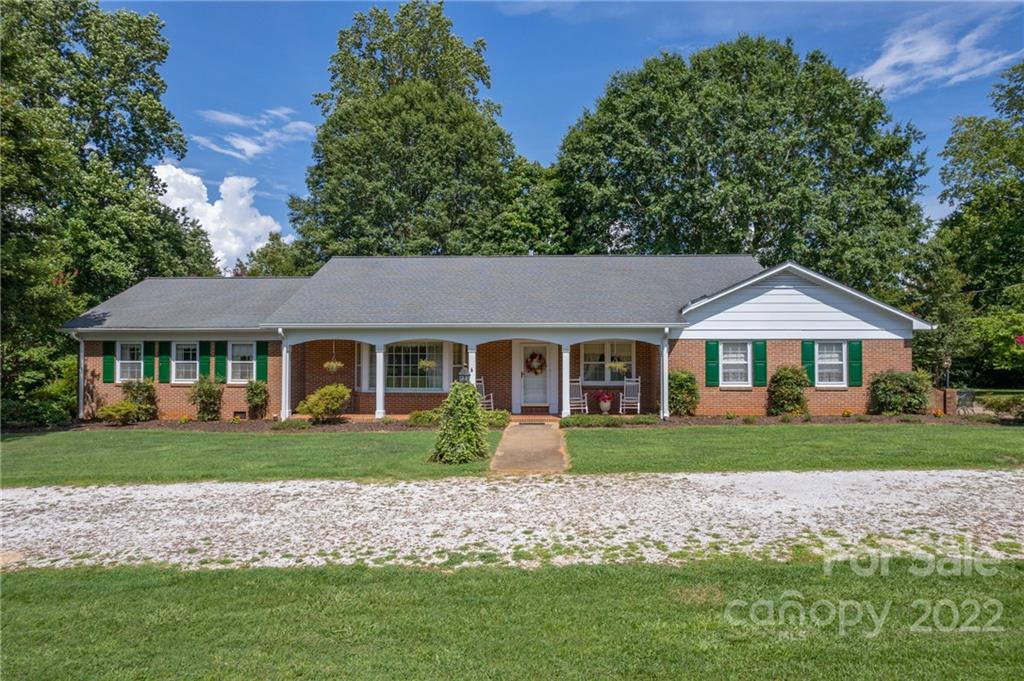 761 Poors Ford Road Rutherfordton, NC 28139 - Photo 1 of 48 a front view of a house with a garden