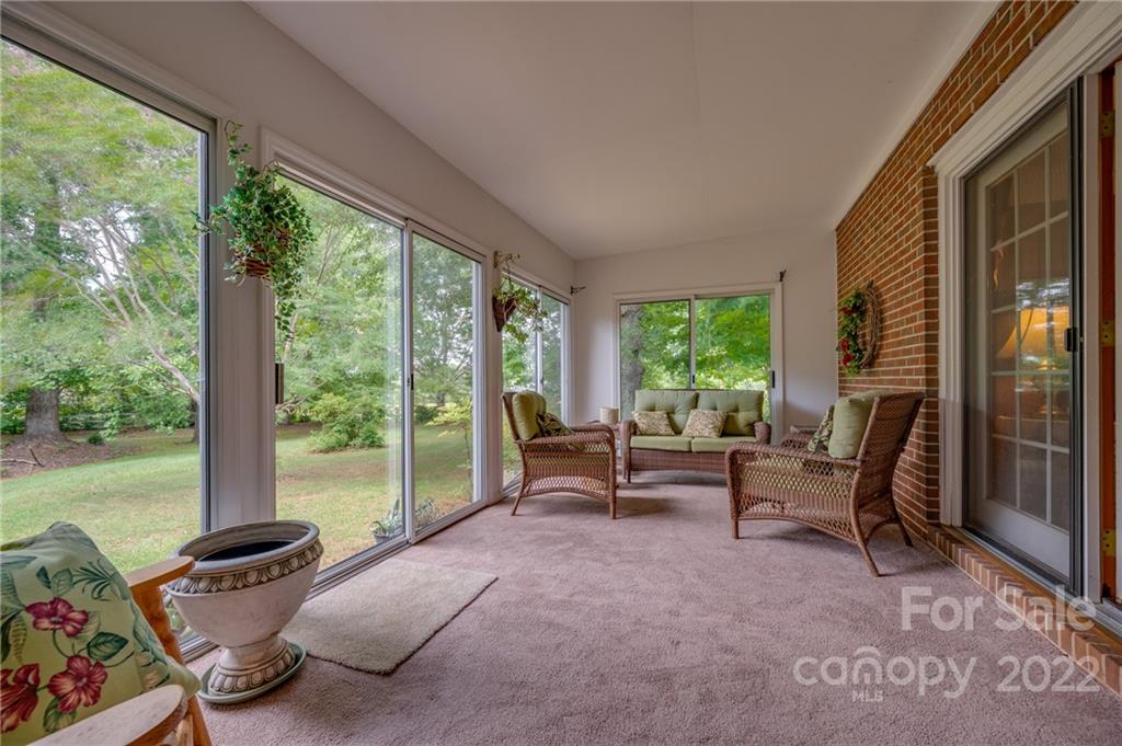 761 Poors Ford Road Rutherfordton, NC 28139 - Photo 23 of 48 a living room with furniture and a floor to ceiling window
