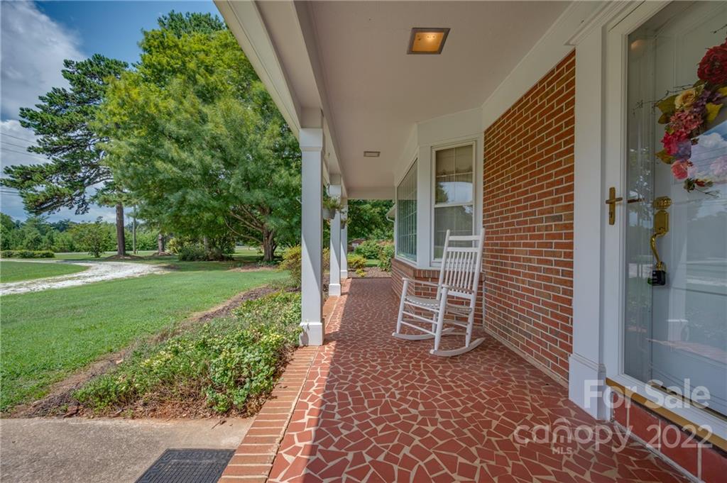 761 Poors Ford Road Rutherfordton, NC 28139 - Photo 8 of 48 a view of a chair and table in backyard of the house