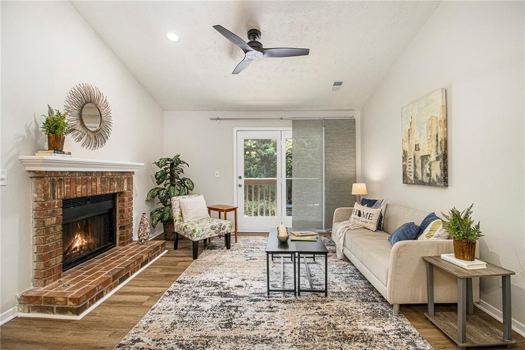 a living room with furniture and a fireplace