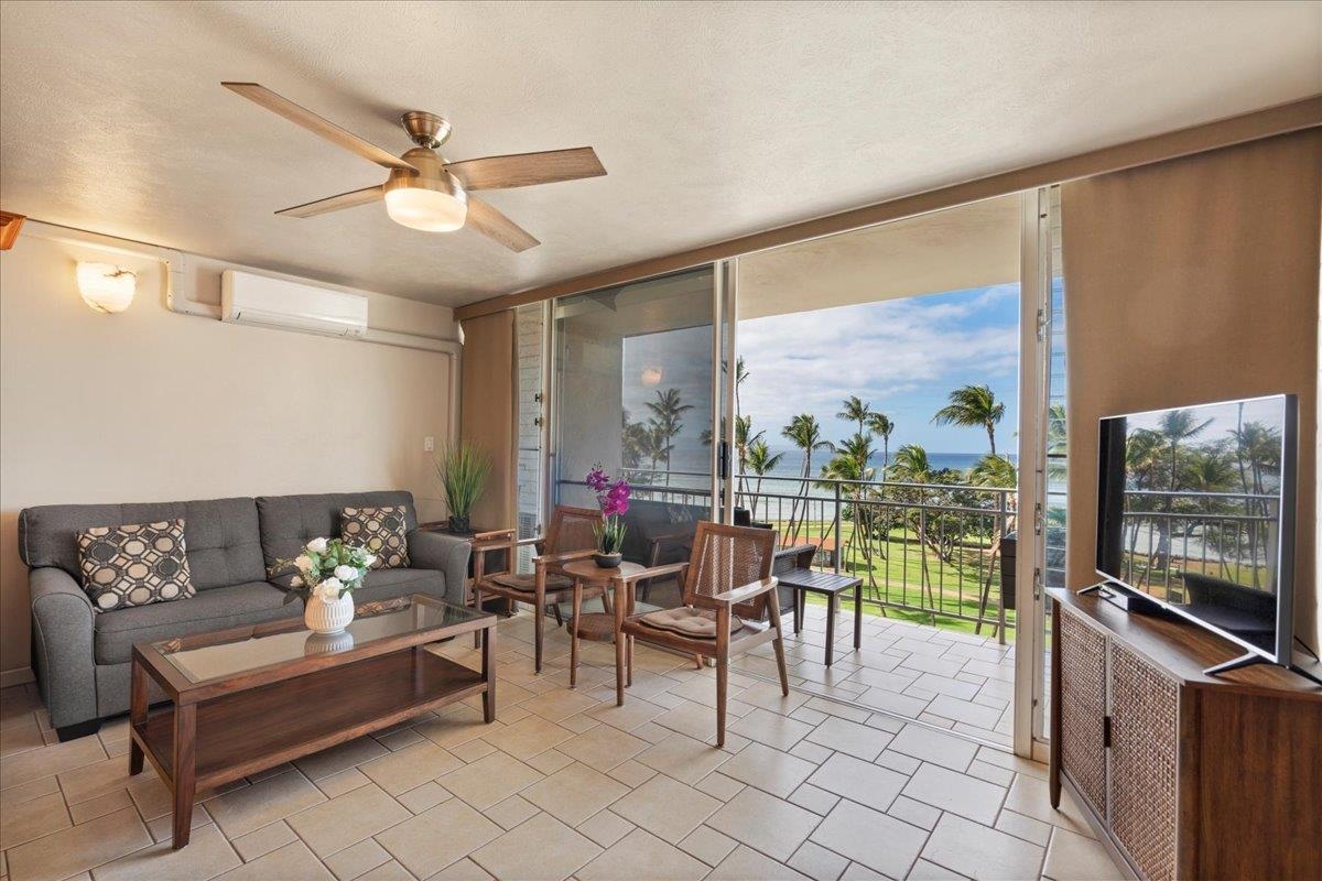 1993 South Kihei Road, Unit 601 Kihei, HI 96753 - Photo 16 of 45 a living room with furniture tv and outdoor view