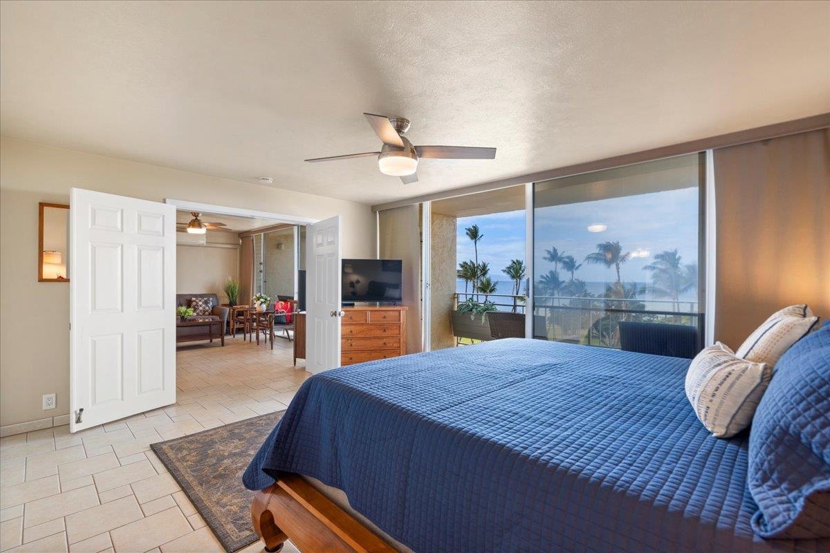 1993 South Kihei Road, Unit 601 Kihei, HI 96753 - Photo 18 of 45 a bed room with a bed and a large window