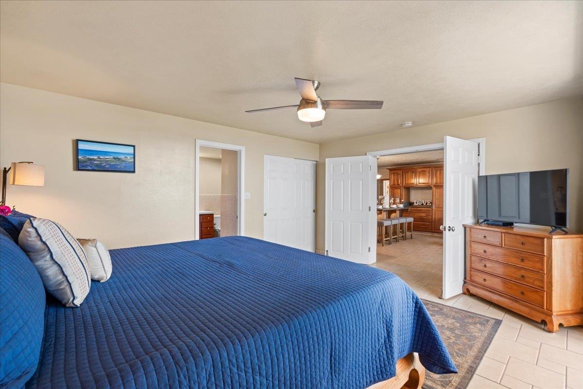 1993 South Kihei Road, Unit 601 Kihei, HI 96753 - Photo 20 of 45 a bedroom with a bed and dresser