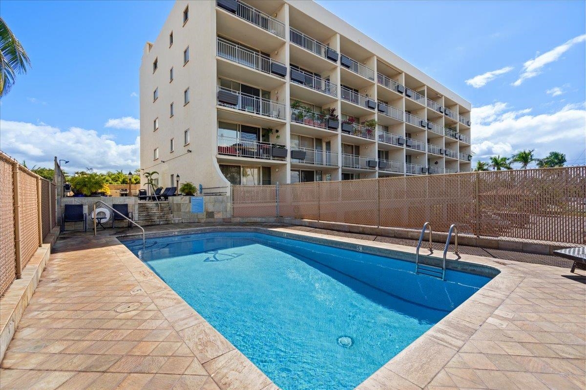 1993 South Kihei Road, Unit 601 Kihei, HI 96753 - Photo 41 of 45 a swimming pool with outdoor seating