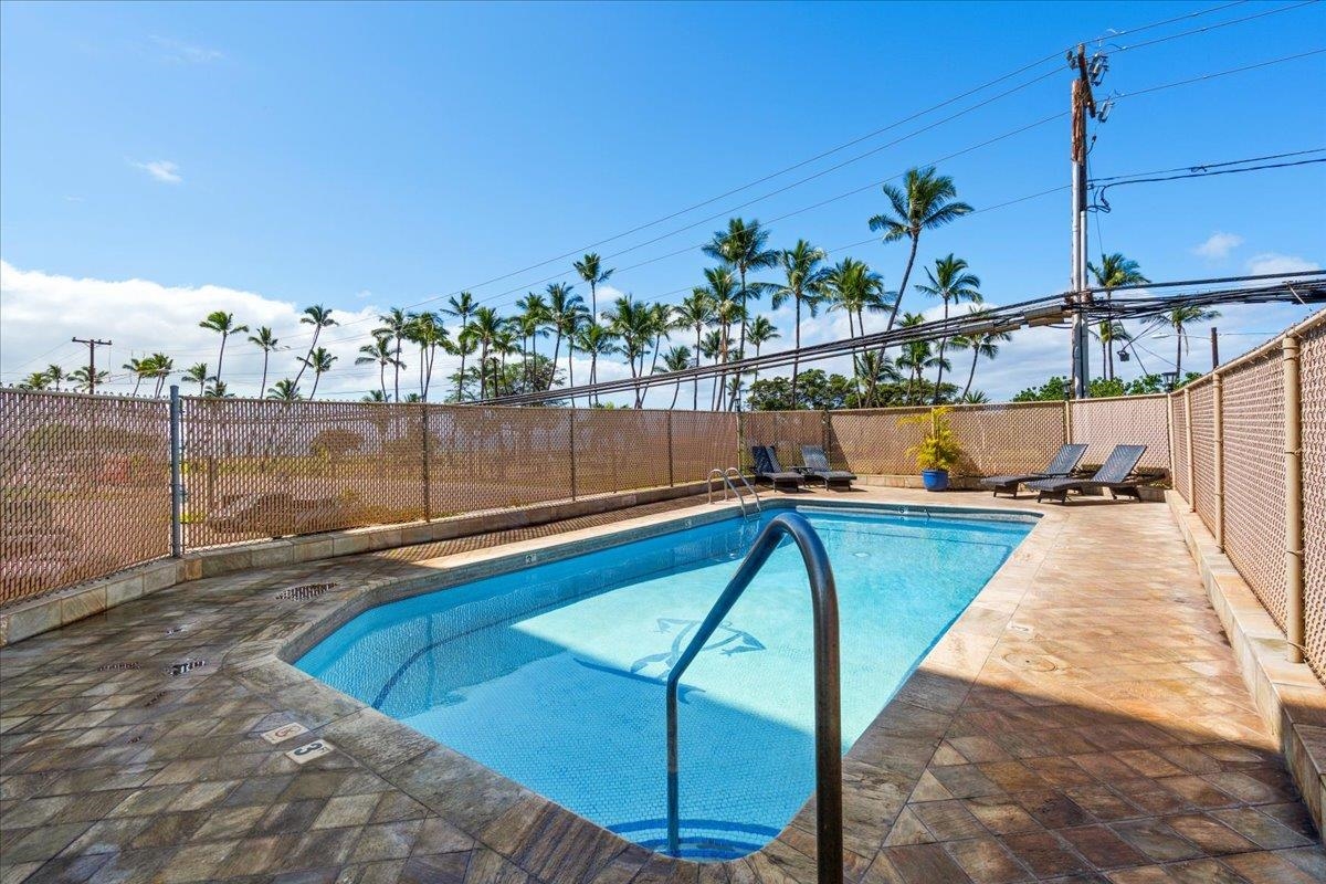 1993 South Kihei Road, Unit 601 Kihei, HI 96753 - Photo 43 of 45 a view of a swimming pool with a chairs