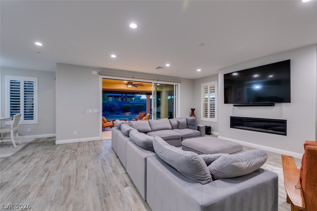 8615 Jerlyn Street Las Vegas, NV 89113 - Photo 16 of 76 Sliding doors to yard and fireplace