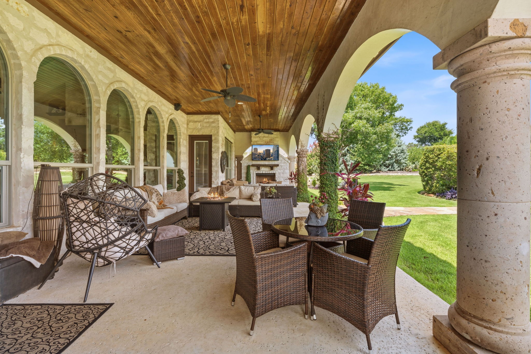 816 Brave Face Street Leander, TX 78641 - Photo 27 of 40 An inviting covered patio offers an outdoor fireplace and direct yard access, perfect for alfresco enjoyment.