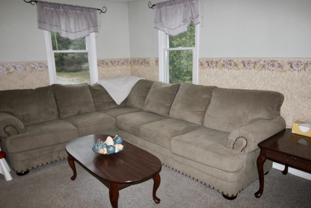 28 Hillside Road Rochester, MA 02770 - Photo 11 of 20 a living room with furniture and a large window