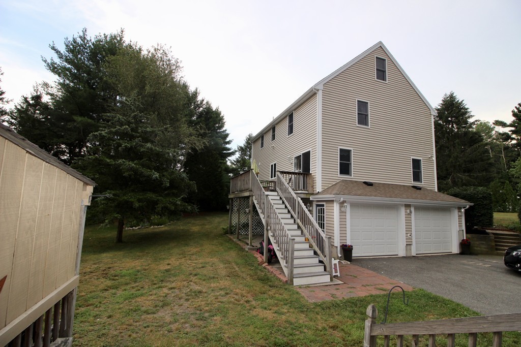28 Hillside Road Rochester, MA 02770 - Photo 3 of 20 a view of a house with backyard and a tree