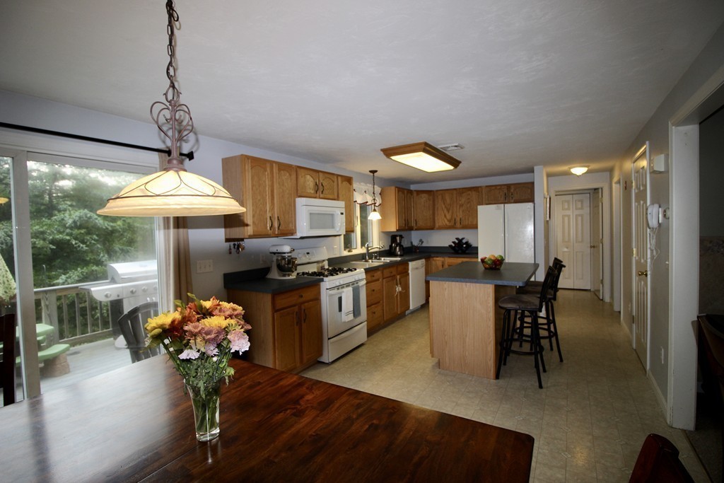 28 Hillside Road Rochester, MA 02770 - Photo 7 of 20 a kitchen with counter top space and stainless steel appliances