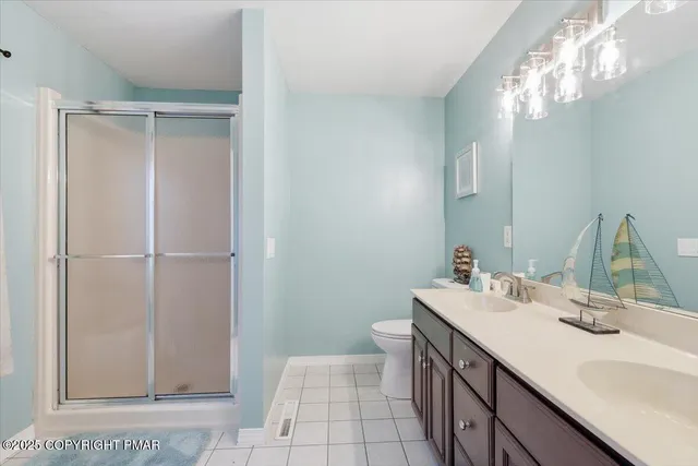 a bathroom with a sink a vanity and a mirror