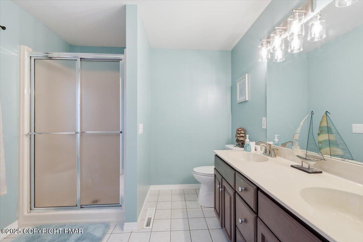 126 Snyder Lane Scotrun, PA 18355 - Photo 13 of 22 a bathroom with a sink a vanity and a mirror