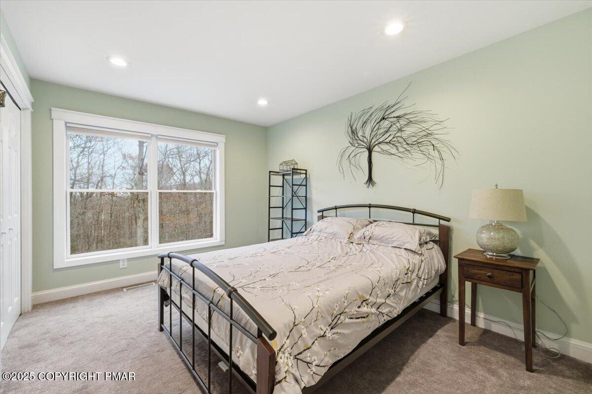 126 Snyder Lane Scotrun, PA 18355 - Photo 14 of 22 a bedroom with a bed and a window