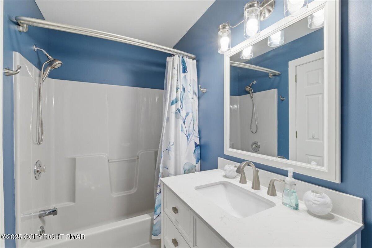 126 Snyder Lane Scotrun, PA 18355 - Photo 15 of 22 a bathroom with a sink double vanity mirror and a bathtub