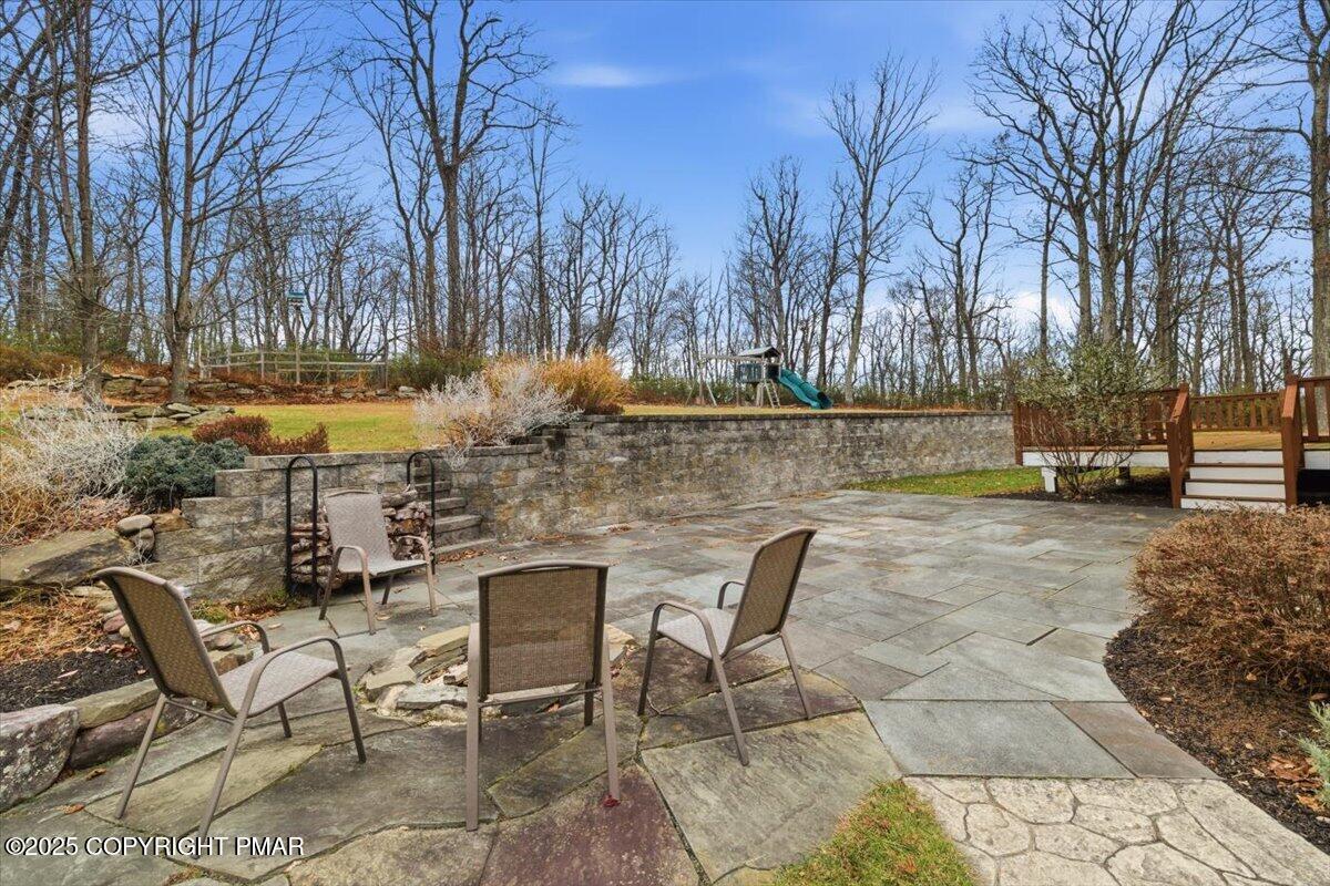 126 Snyder Lane Scotrun, PA 18355 - Photo 21 of 22 a view of a lake with table and chairs