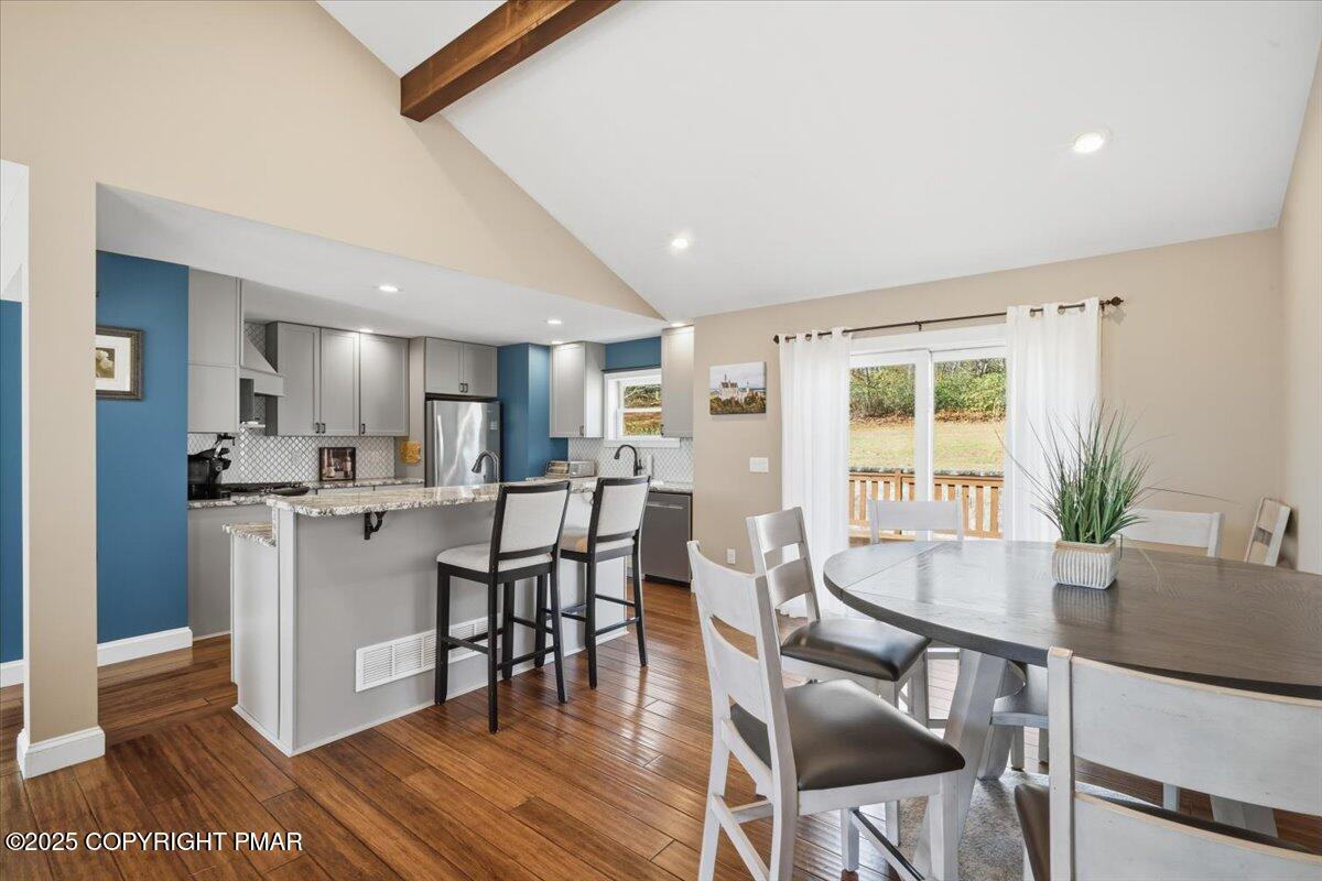 126 Snyder Lane Scotrun, PA 18355 - Photo 6 of 22 a view of a dining room with furniture and wooden floor