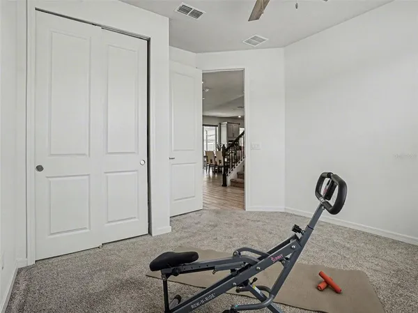 a living room with furniture and a rug