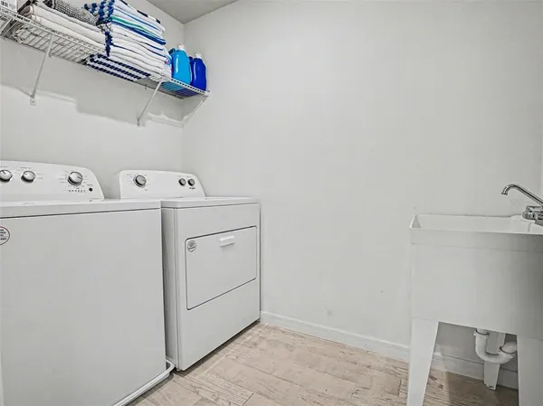 a view of storage and utility room with washer and dryer