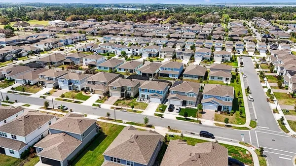an aerial view of a city with lots of residential buildings