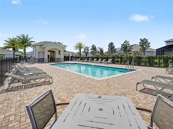 a view of a swimming pool with a patio
