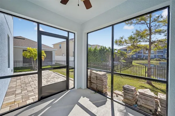 a view of a living room and a floor to ceiling window