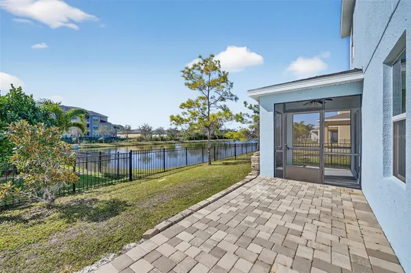 a house view with swimming pool in front of it