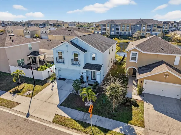 a aerial view of a house with a yard