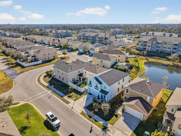 an aerial view of a house with a ocean view