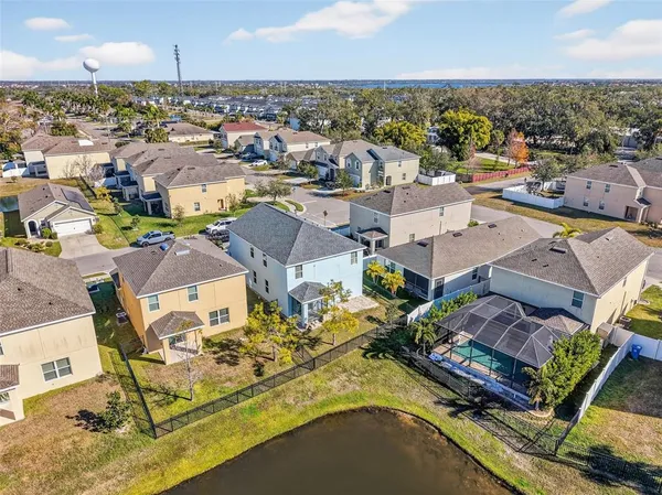 an aerial view of residential houses with outdoor space