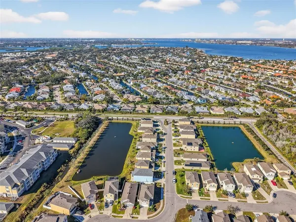 an aerial view of residential houses with outdoor space