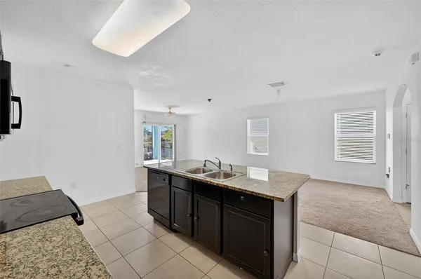 a kitchen with a sink and a stove