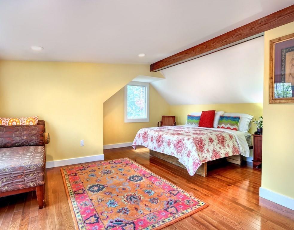 11 Juniper Ridge Road Lincoln, MA 01773 - Photo 14 of 36 a bedroom with a bed and wooden floor
